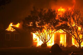 The Park Fire burns a building off Cohasset Rd. in Chico, Calif. on July 25, 202