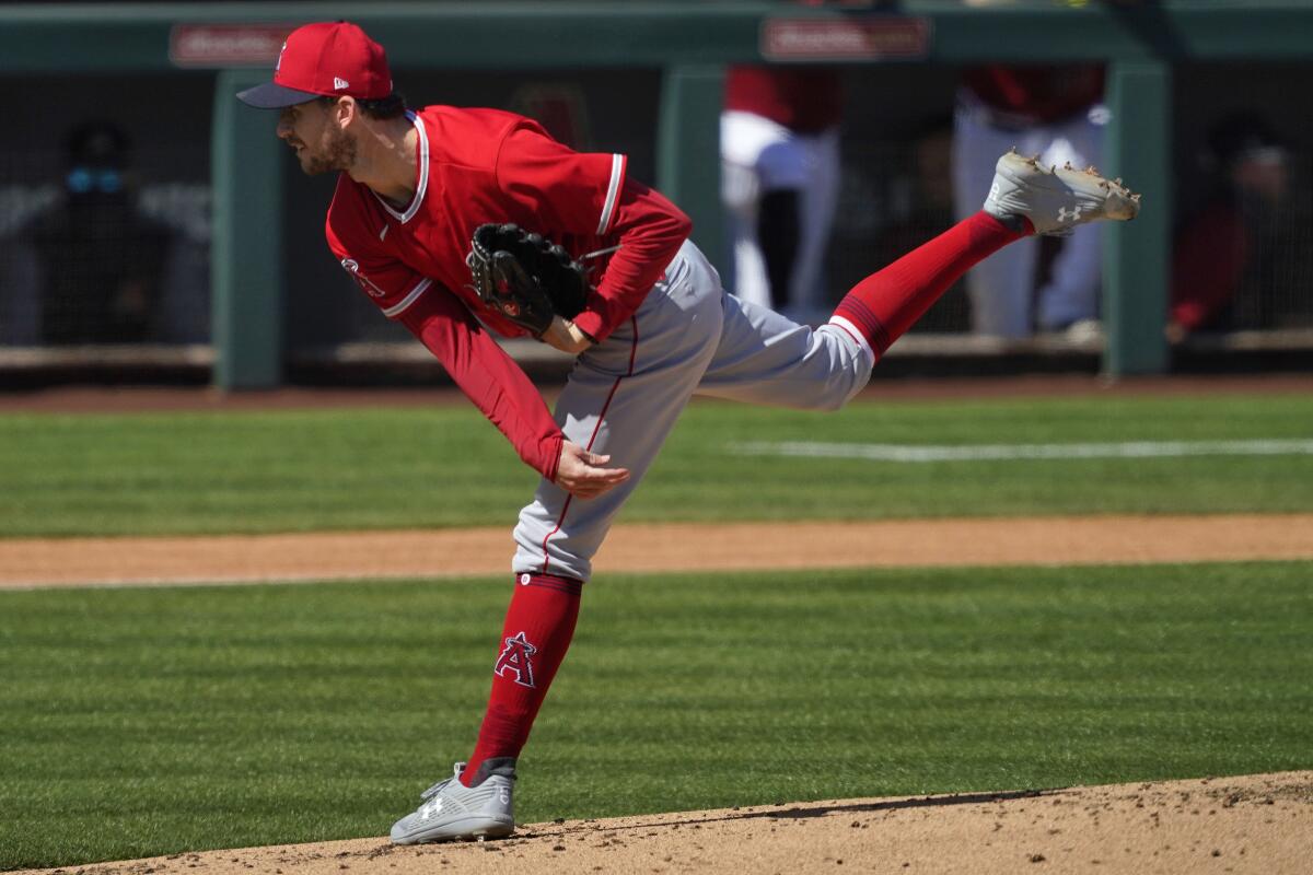 Angels pitcher Griffin Canning throws during a spring training game.
