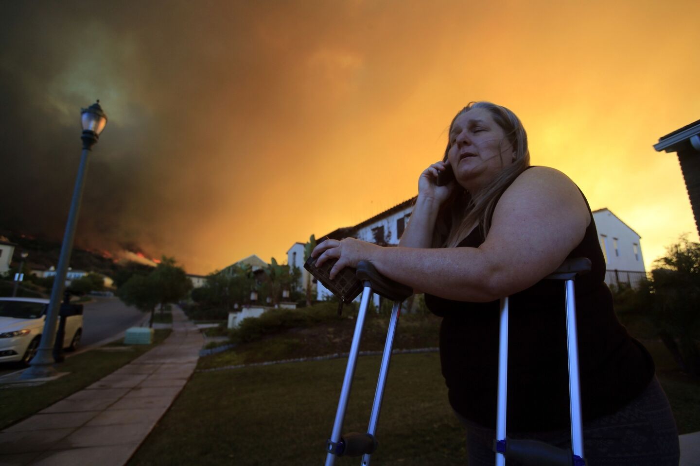 Glendora resident Cathy Doherty waits to be evacuated in the 500 block of Viewcrest Drive in Glendora as the Colby fire continues to burn.
