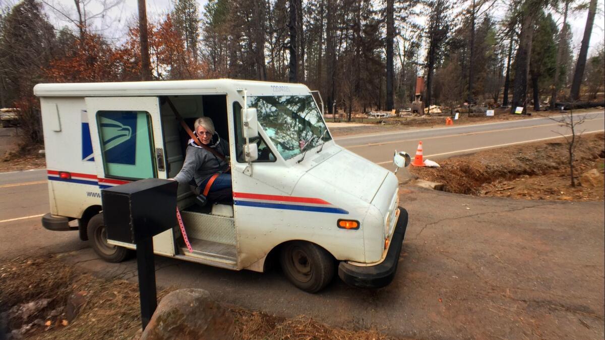 Postal worker Theresa Knowles delivered mail recently to residents of Paradise, Calif., whose homes survived the deadly Camp fire.
