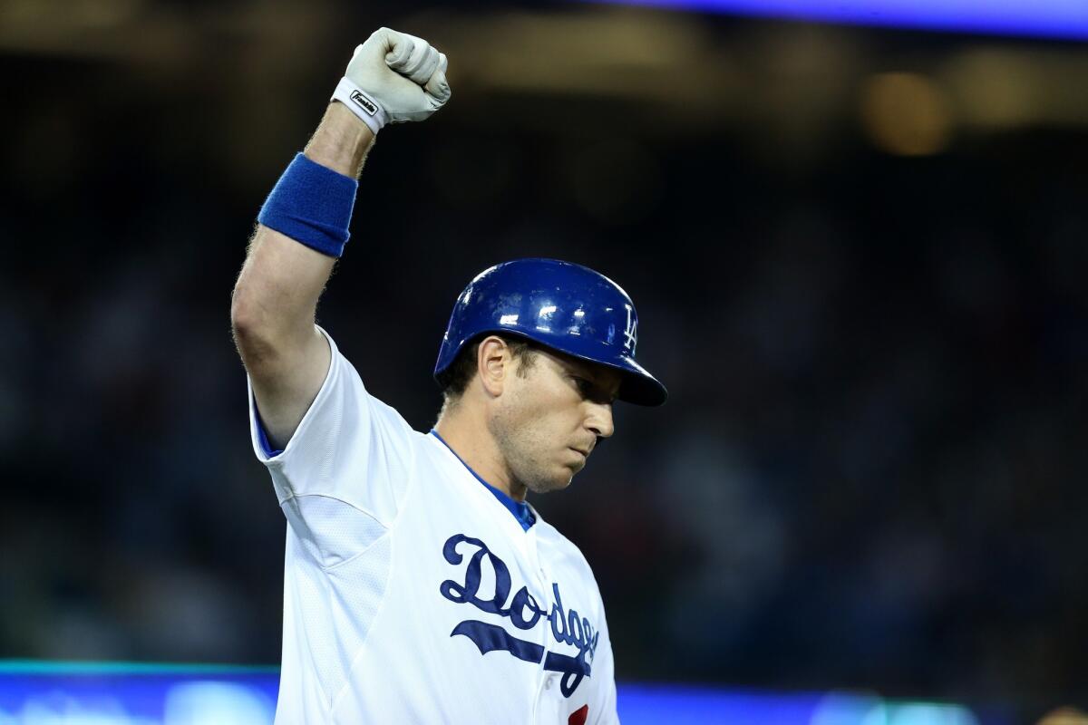 A.J. Ellis celebrates after hitting a walk-off sacrifice fly for the only run of the game Saturday night against the Padres.