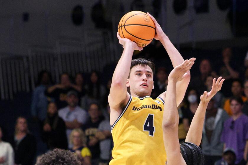 UC San Diego guard Bryce Pope (4) shoots a 3-pointer during a Feb. 24 game against UC Irvine.