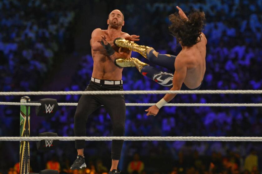 Mansoor (R) fights against Cesaro during the World Wrestling Entertainment (WWE) Crown Jewel pay-per-view in Riyadh on October 31, 2019. (Photo by Fayez Nureldine / AFP) (Photo by FAYEZ NURELDINE/AFP via Getty Images)