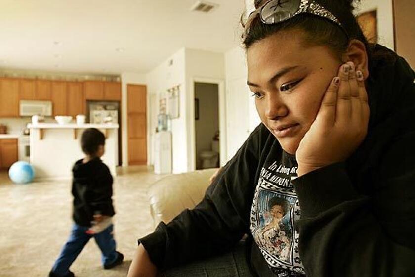 Susana Tupou sits in the family room of her Stockton home, her eyes fixed on the spot where her mother lay dying a year ago.