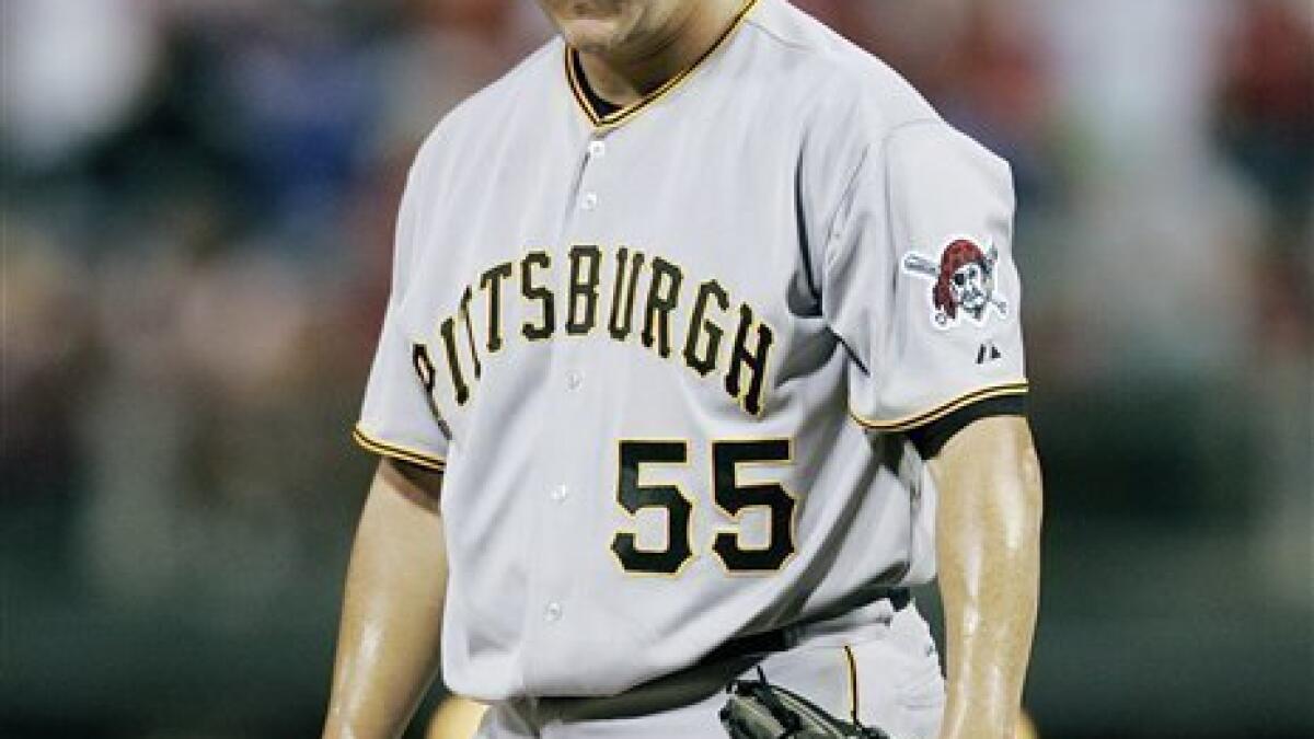 Pittsburgh Pirates' Jason Bay, right, talks with manager John