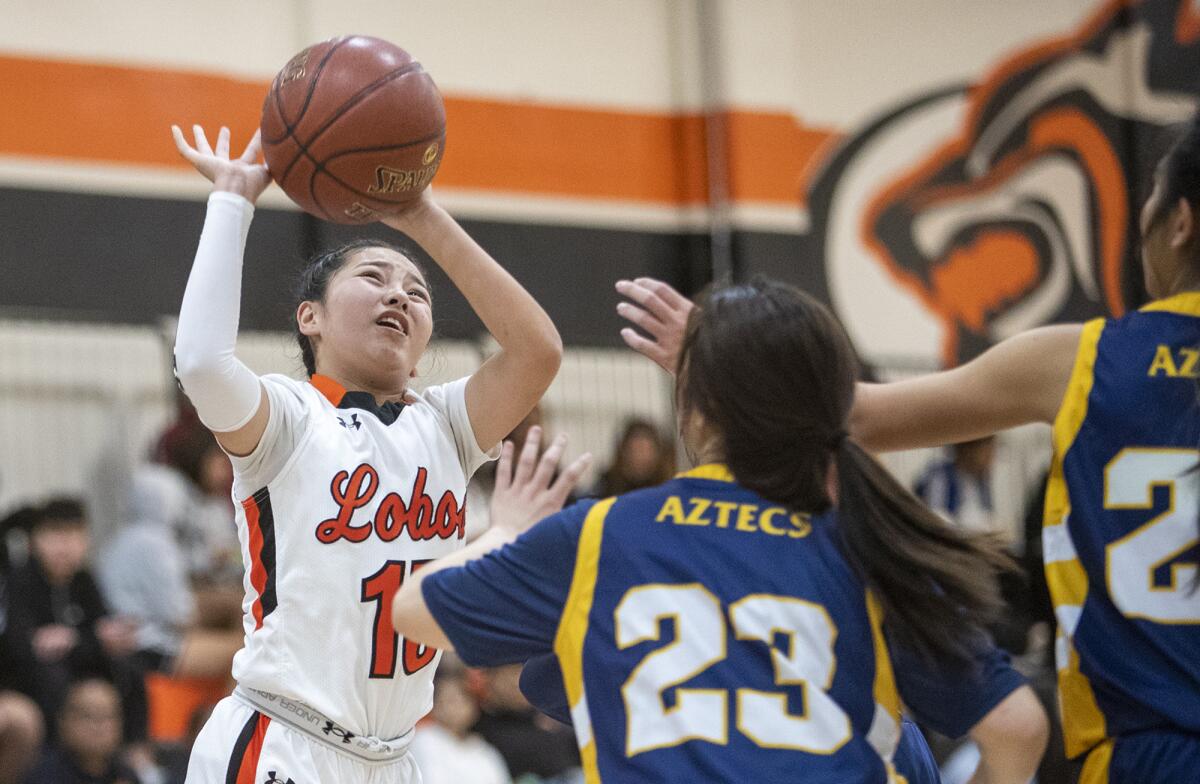 Los Amigos's Kathleen Nguyen goes up for a shot during a Garden Grove League game against La Quinta on Jan. 10.