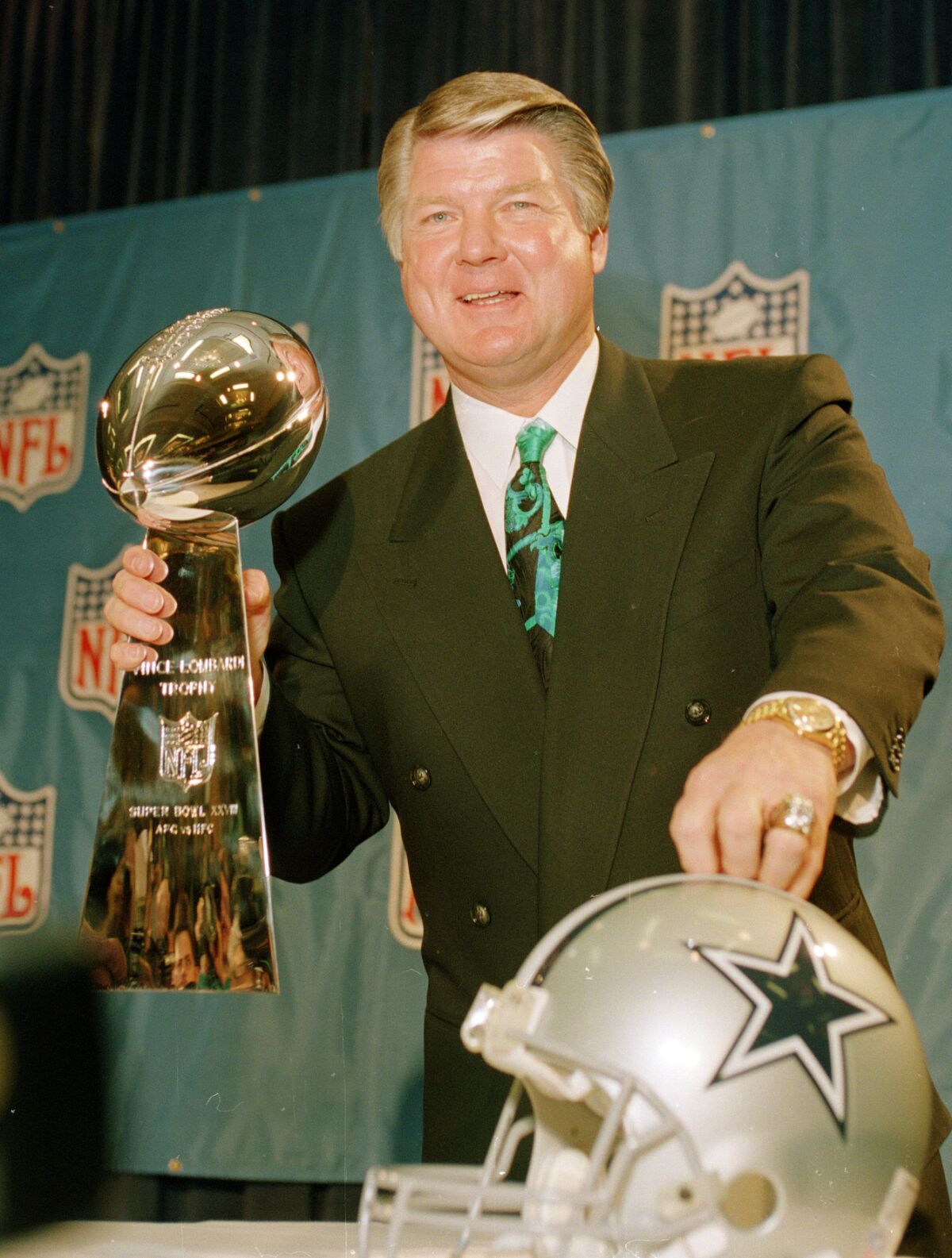 FILE - In this Jan. 28, 1994, file photo, Dallas Cowboys head coach Jimmy Johnson poses with the Vince Lombardi Super Bowl trophy during an NFL football news conference in Atlanta. Five Super Bowl-winning coaches, including Johnson, and such NFL champion players as Roger Craig, Drew Pearson and Donnie Shell are among the finalists for the Pro Football Hall of Fame's special centennial class announced Thursday, Dec. 19, 2019. A 25-member panel of pro football experts is charged with selecting 10 senior players, two coaches and three contributors who will be inducted into the Canton, Ohio shrine next year as part of the league's celebration of its 100th season. (AP Photo/Ron Heflin, File)