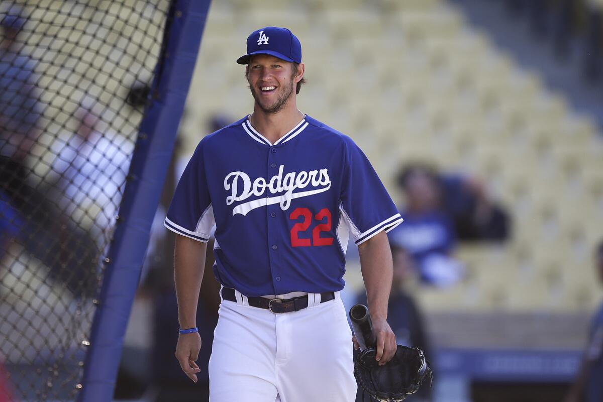 Dodgers starting pitcher Clayton Kershaw smiles before a game against the Philadelphia Phillies on Thursday. Kershaw threw a bullpen session prior to Sunday's game against the Colorado Rockies.