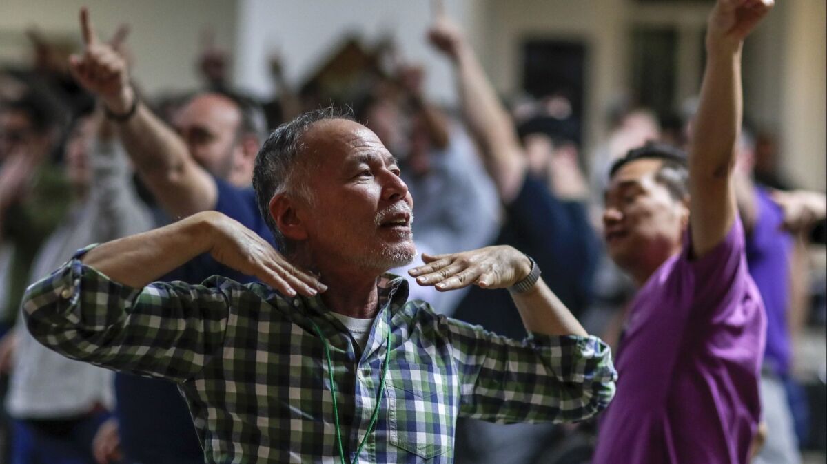 Tenor Gary Hayashi rehearses with the Gay Men's Chorus of Los Angeles at the First Congregational Church of Los Angeles. Hayashi was 42 when he came out, and the group provided a sense of belonging.
