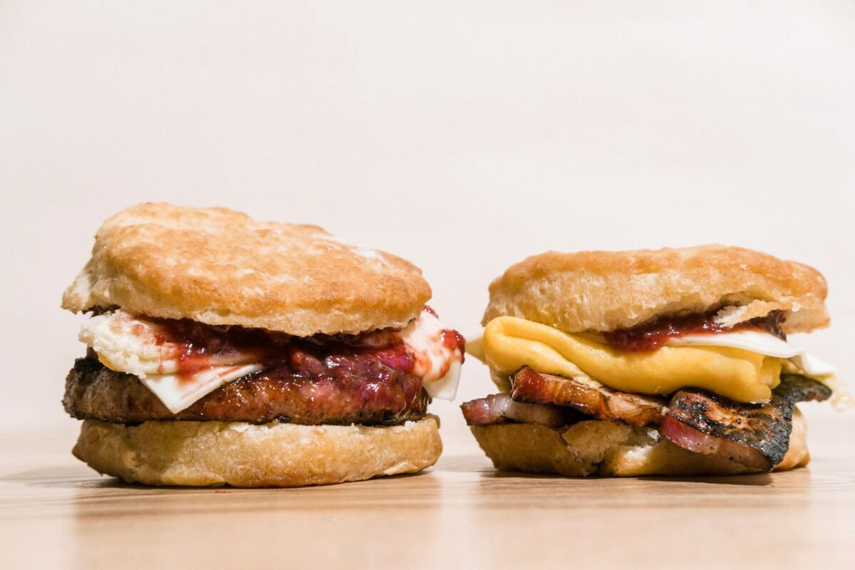 From left, an ADB biscuit breakfast sandwich with sausage and an ADB biscuit breakfast sandwich with bacon.