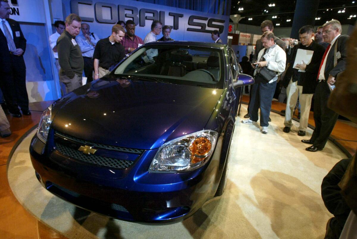 A new 2005 Chevrolet Cobalt is displayed at the Los Angeles Auto Show in 2003. The Cobalt is one of several GM models the company is recalling to fix an issue with the ignition switch that has caused some cars to accidentally shut off, leading to fatal crashes.