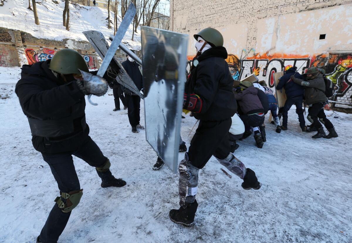 A Ukrainian opposition self-defense unit undergo training on repelling riot police and waging counterattacks in central Kiev.
