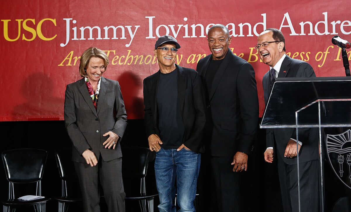 From left, USC dean Erica Muhl, music mogul Jimmy Iovine, rapper Dr. Dre (given name Andre Young) and USC President C.L. Max Nikias at the May 2013 launch event for the USC Jimmy Iovine and Andre Young Academy for Arts, Technology and the Business of Innovation.