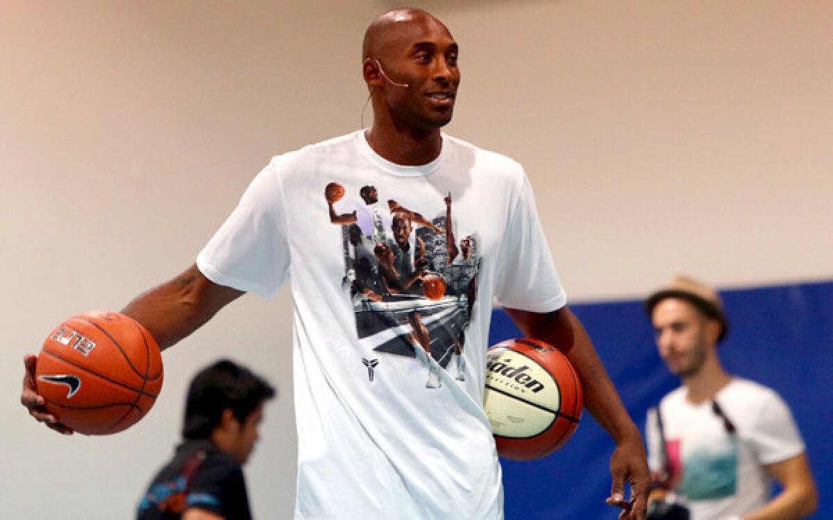 Lakers star Kobe Bryant leads a training session at the Gems American Academy in Abu Dhabi on Tuesday as part of a health and fitness seminar.