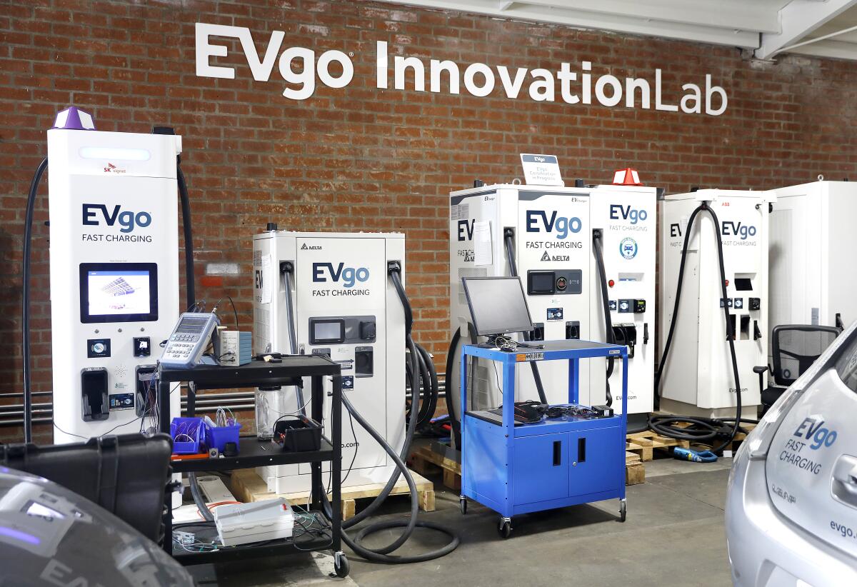 a wall of electric vehicle chargers at EVgo Innovation Lab 