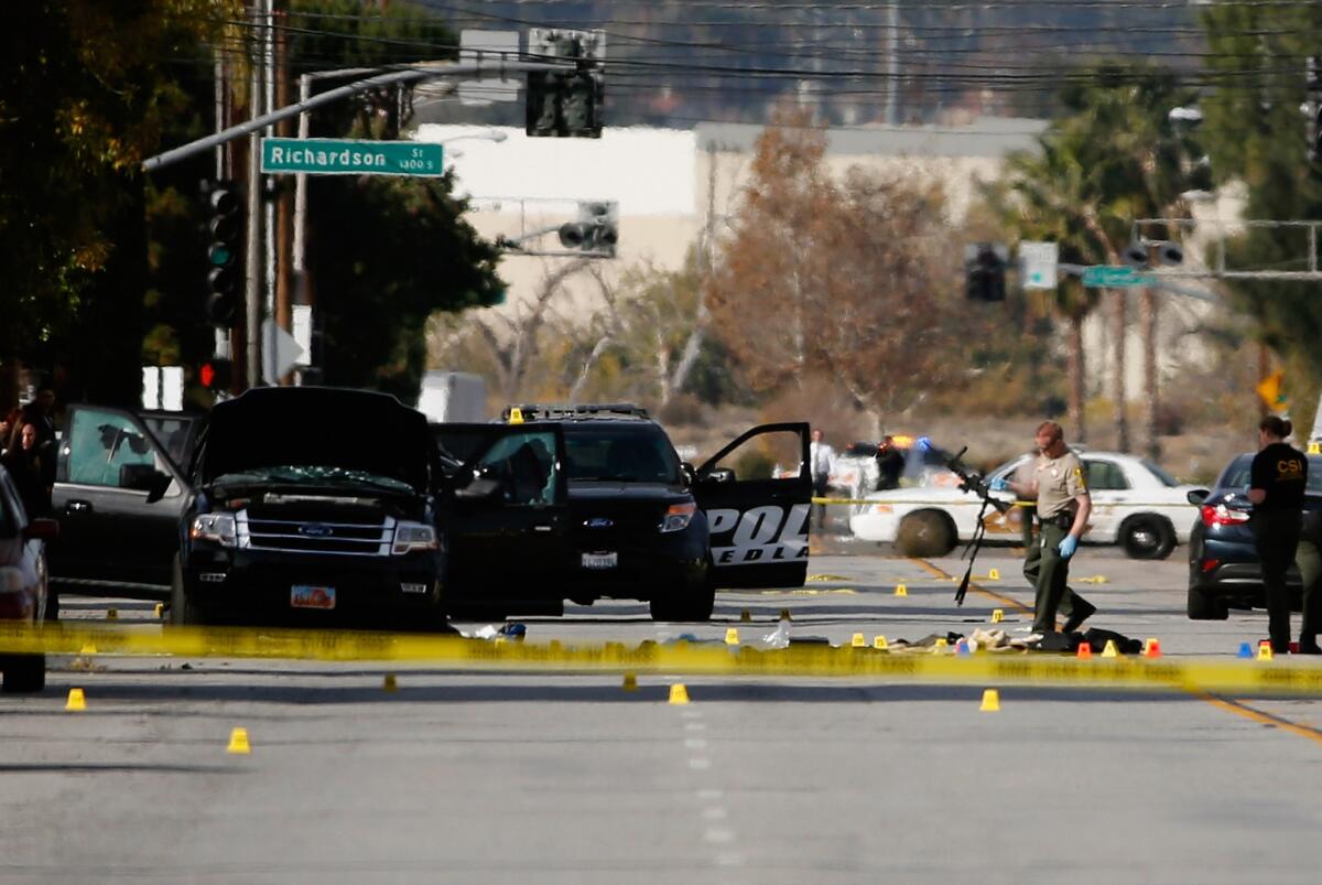 Evidence collection continues Thursday at the scene where the two suspects in Wednesday's mass shooting at the Inland Regional Center in San Bernardino were killed in a gun battle with police.