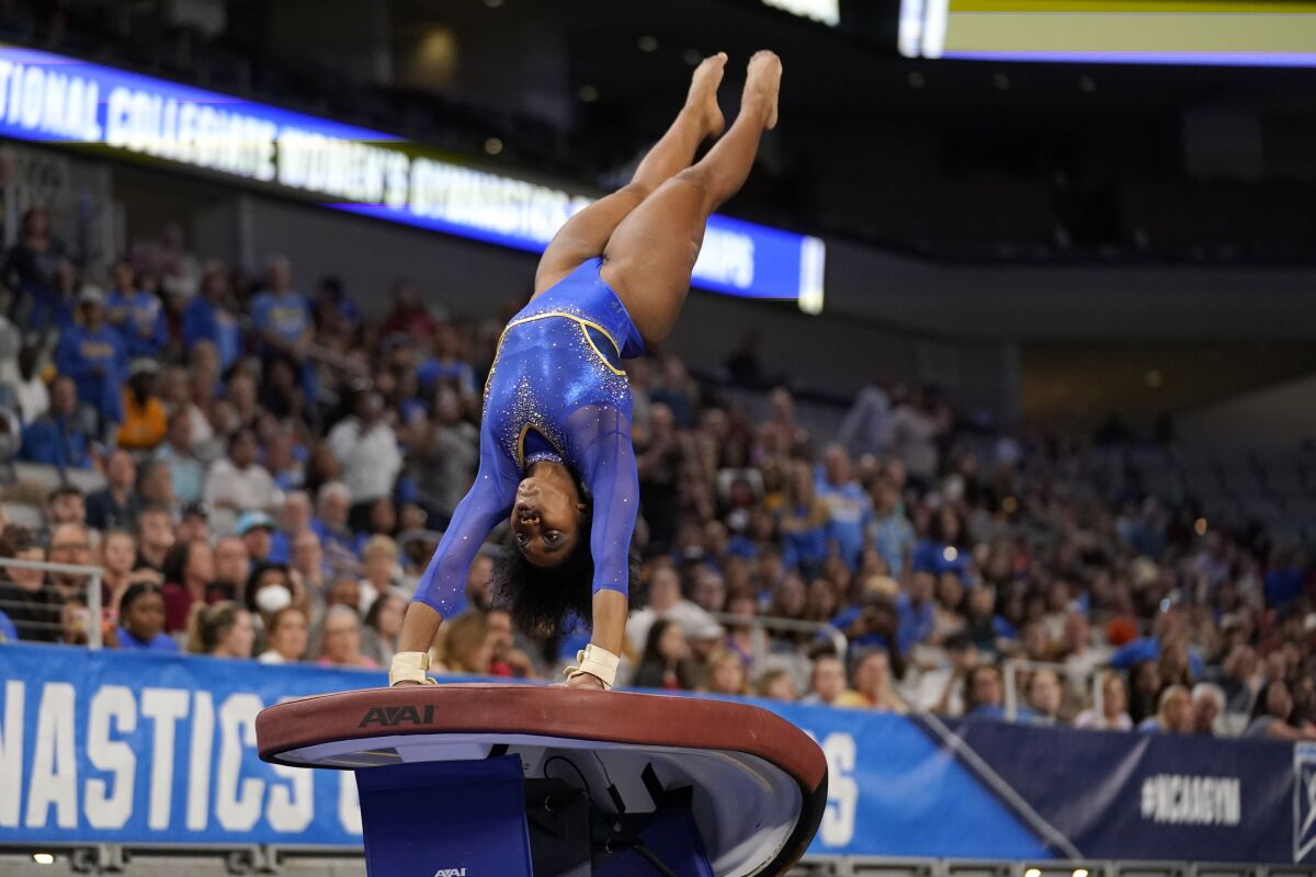 UCLA's Chae Campbell competes in the vault at the NCAA championship semifinals.