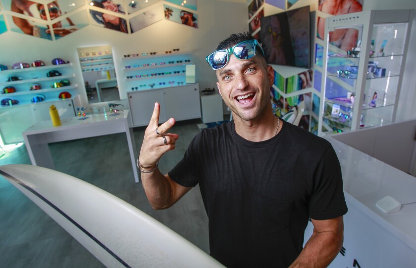 Surfer and company founder Chase Fisher poses for photos in the Blender Eyewear showroom on October 10, 2019 in Pacific Beach, California.