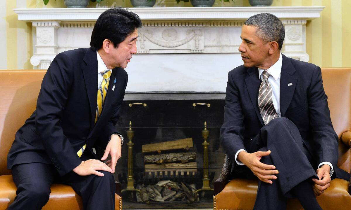 President Obama, right, converses with Japanese Prime Minister Shinzo Abe at the White House.