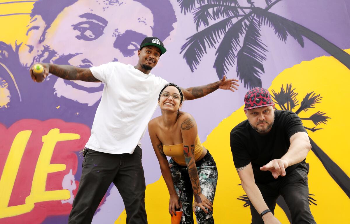 Tony "Concep'" Brown, Mikala Taylor, and Michael Ziobrowski are painting a new Kobe Bryant tribute mural.
