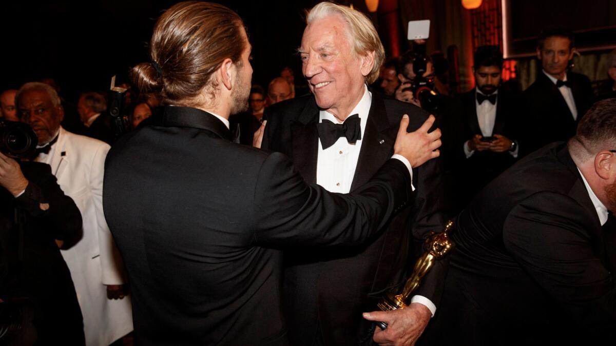 The 2017 Academy of Motion Picture Arts and Sciences' 9th Governors Awards honoree Donald Sutherland is congratulated after the ceremony, at The Ray Dolby Ballroom at Hollywood & Highland Center.