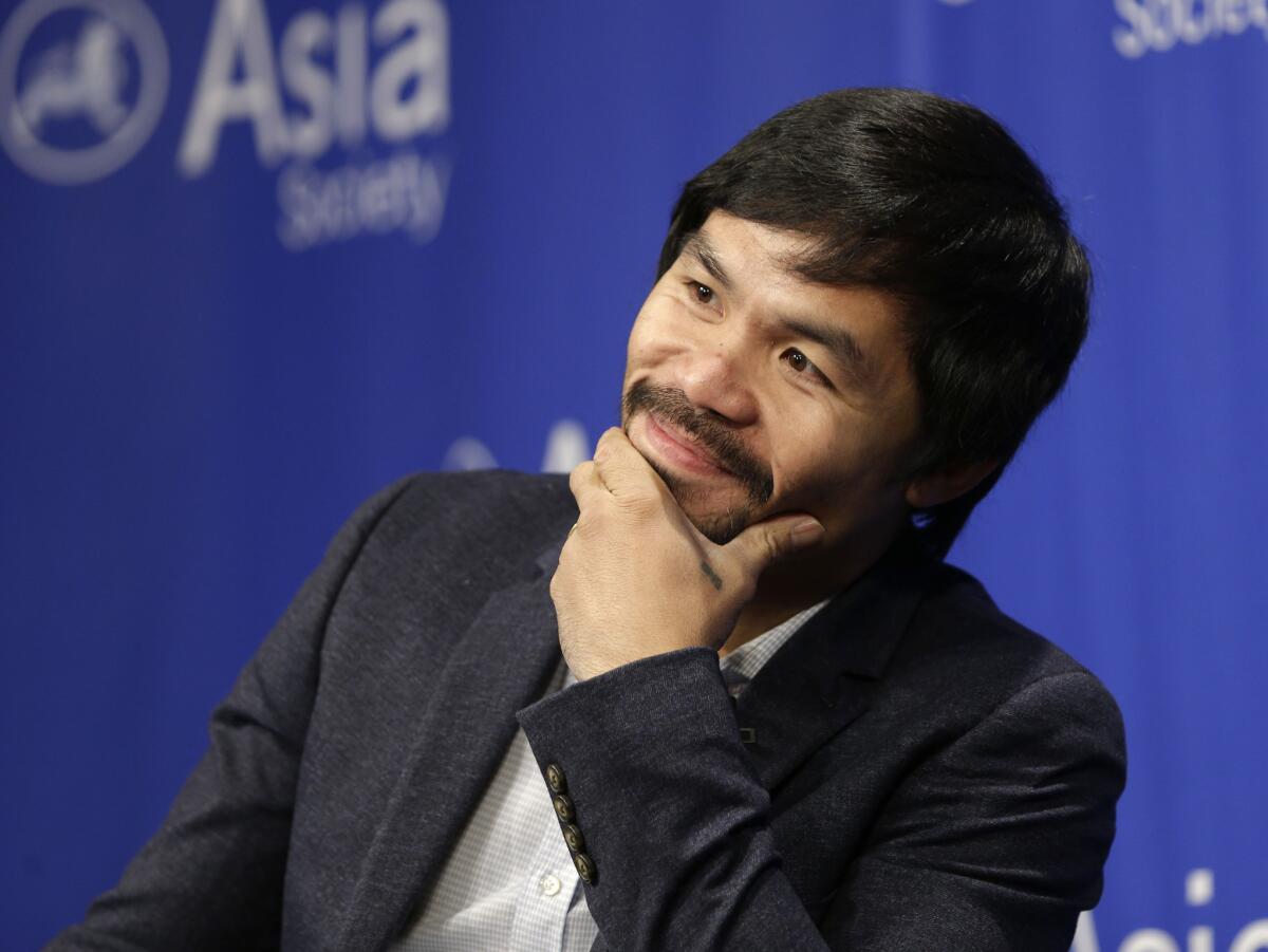 Manny Pacquiao takes questions at the Asia Society in New York on Oct. 12, 2015.