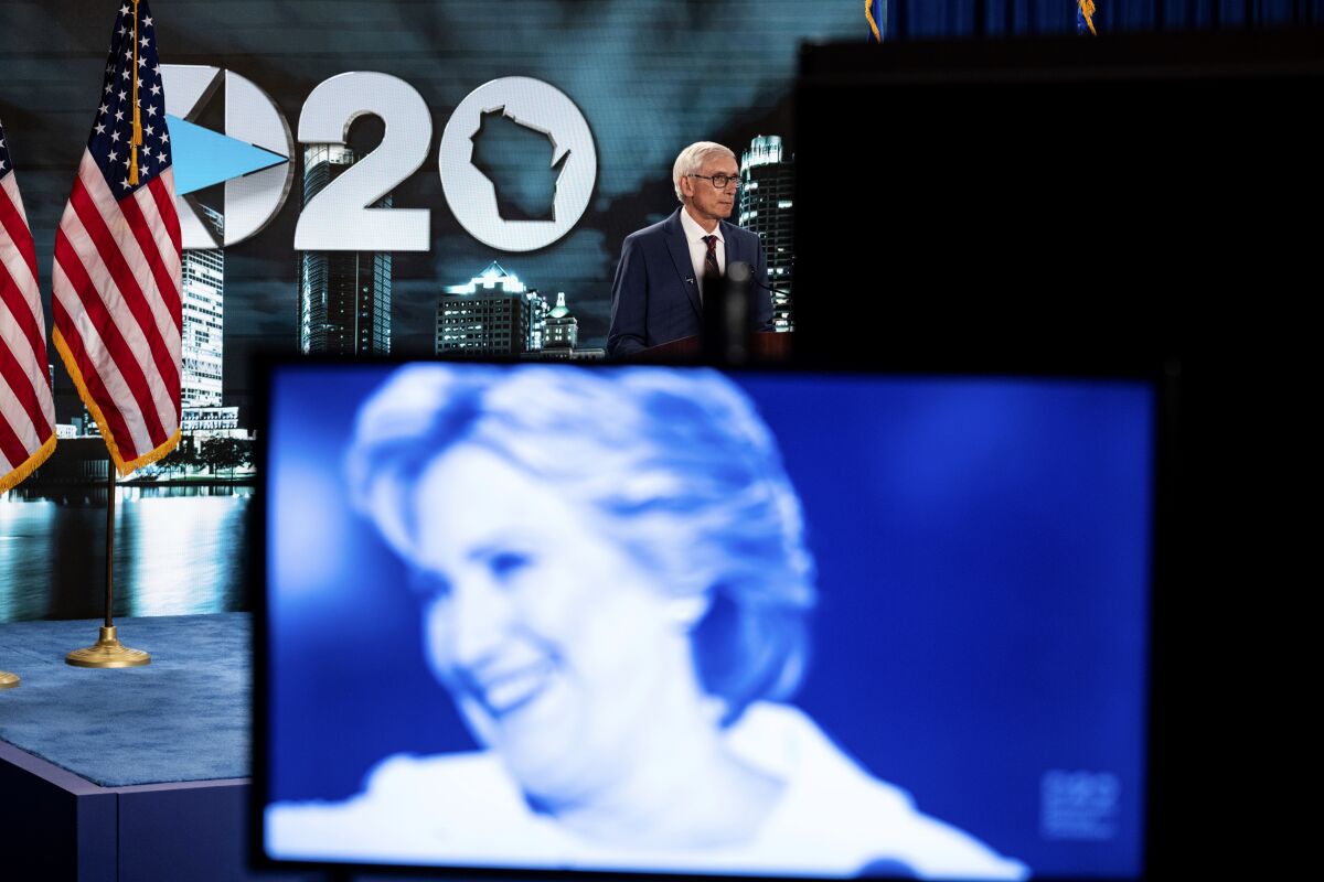 A video showing Hillary Clinton and others played before Wisconsin Gov. Tony Evers spoke