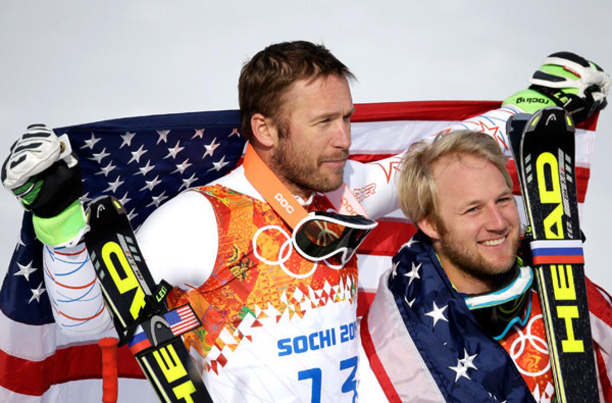 Bronze medalist Bode Miller, left, and silver medalist Andrew Weibrecht of the United States celebrate after the men's super-giant slalom race at the Sochi Olympics on Sunday at Rosa Khutor Alpine Center.