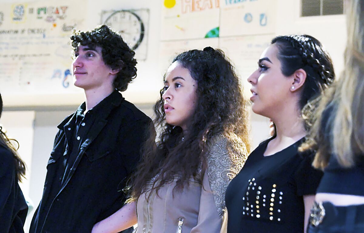 LACHSA students Drew Harris, left, Alondra Santos and Estefani Lopez in opera class. 