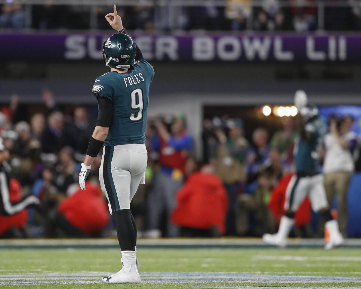 Eagles quarterback Nick Foles celebrates a touchdown pass to Zach Ertz on Sunday during the second half of Super Bowl LII against the New England Patriots.