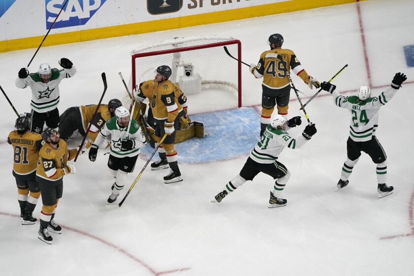 Dallas Stars left wing Jason Robertson (21) celebrates after scoring against the Vegas Golden Knights during the second period of Game 5 of the NHL hockey Stanley Cup Western Conference finals Saturday, May 27, 2023, in Las Vegas. (AP Photo/John Locher)