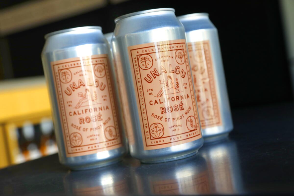 A closeup of cans of Una Lou California rosé.