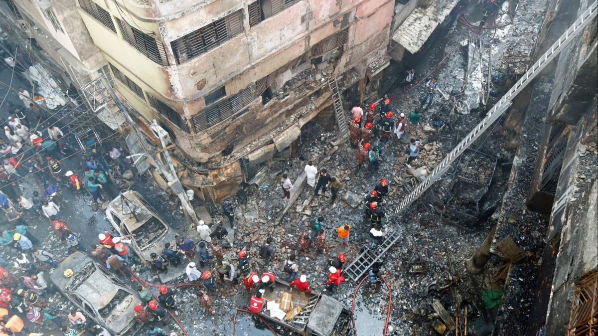 Firefighters inspect the aftermath of a fire that broke out Wednesday in the Chawkbazar area of Old Dhaka in Bangladesh.