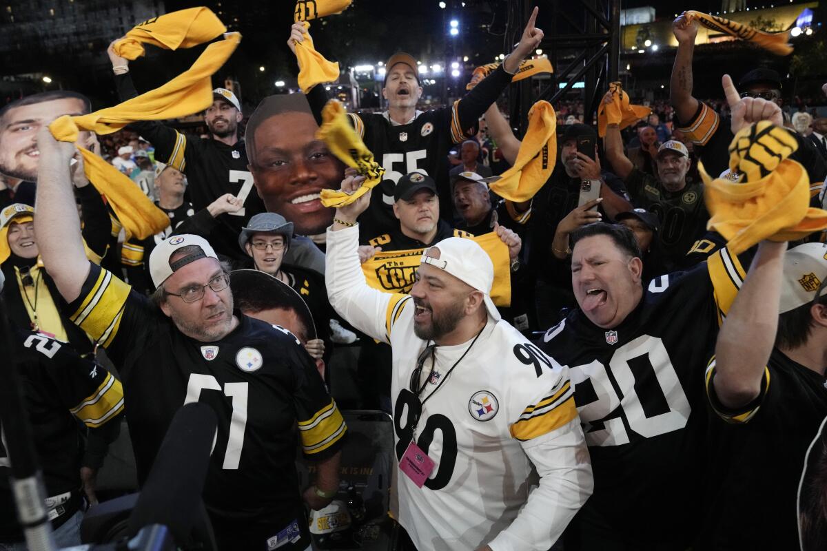 Pittsburgh Steelers fans cheer during the first round of the NFL football draft