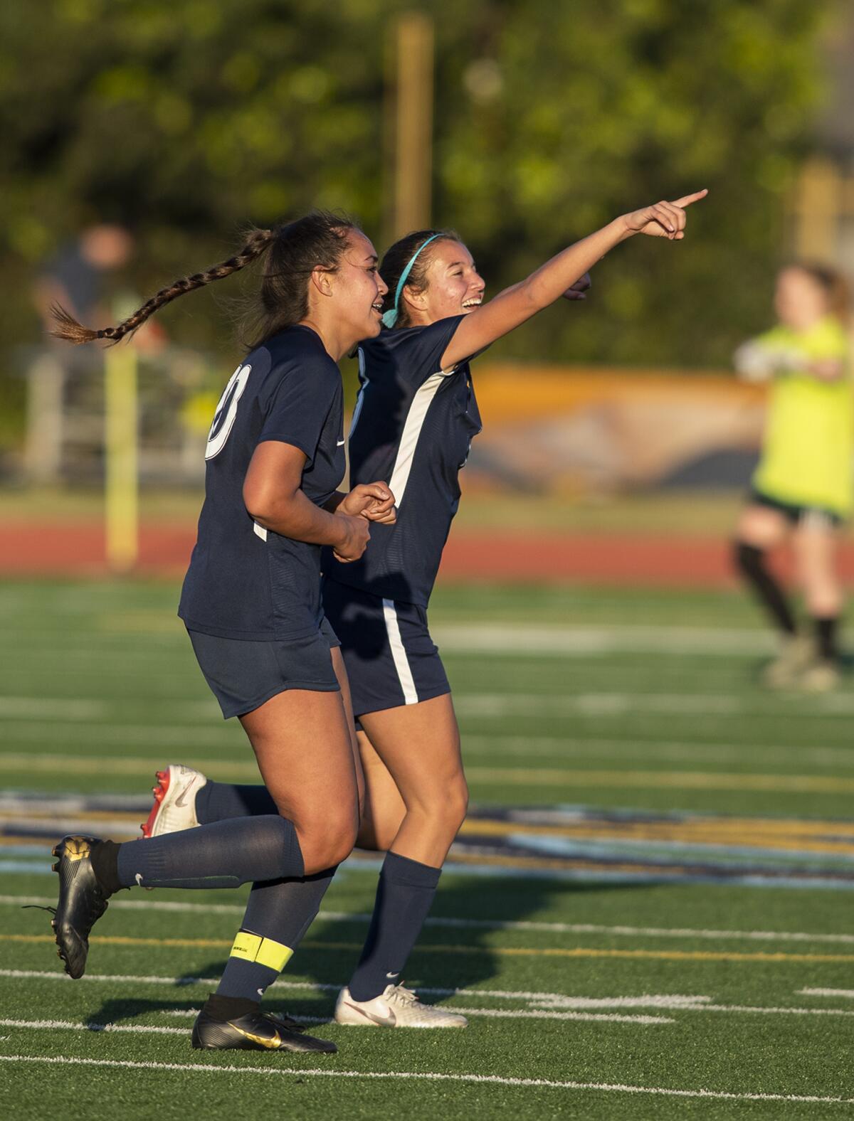 Marina's McKenna Pua, left, and Haley Boren celebrate after beating Newport Harbor 1-0 in a Wave League match on Tuesday.