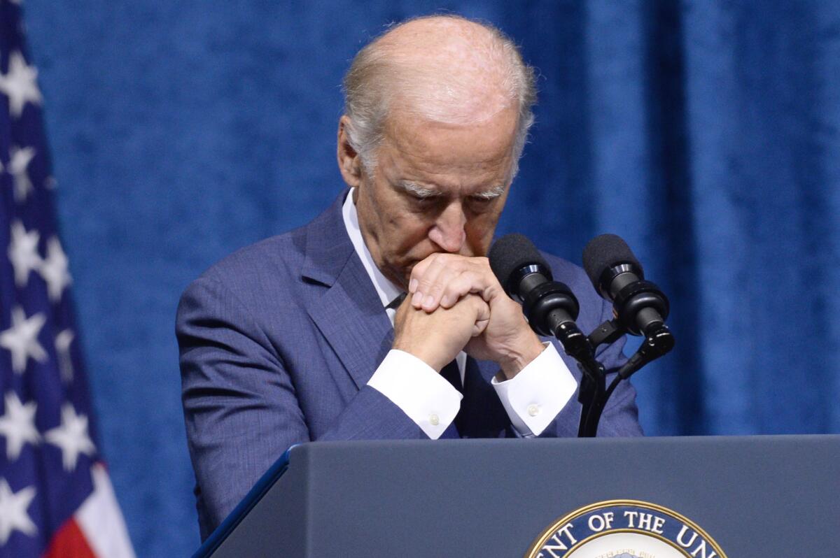 Joe Biden pauses as he speaks at a memorial service to honor the sailor and four Marines killed in Chattanooga, Tenn., by a gunman the vice president called a "perverted jihadist."