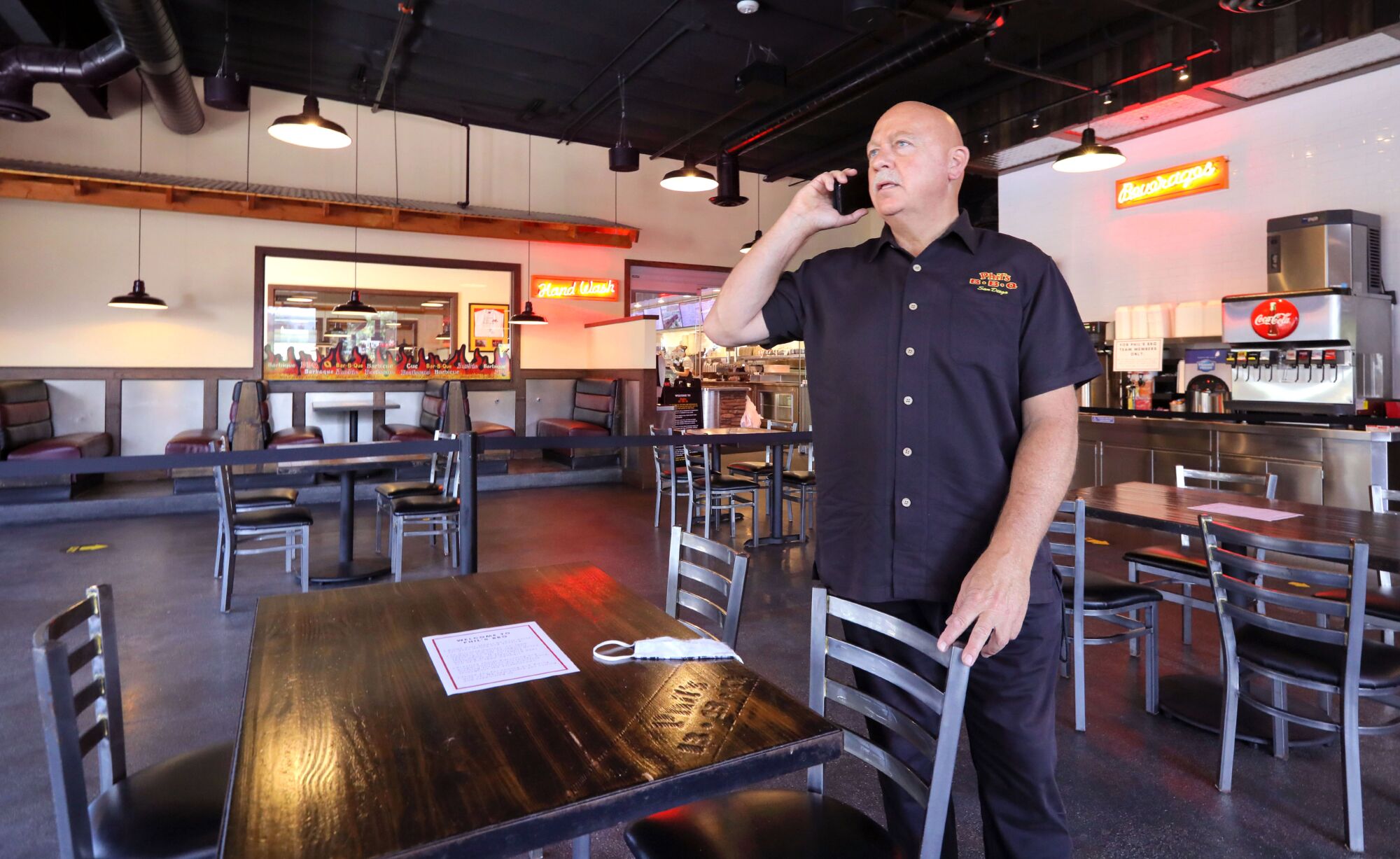 Phil's BBQ owner Phil Pace in his Rancho Bernardo location where he's reconfigured the space for dining-in under the county's new safety regulations.