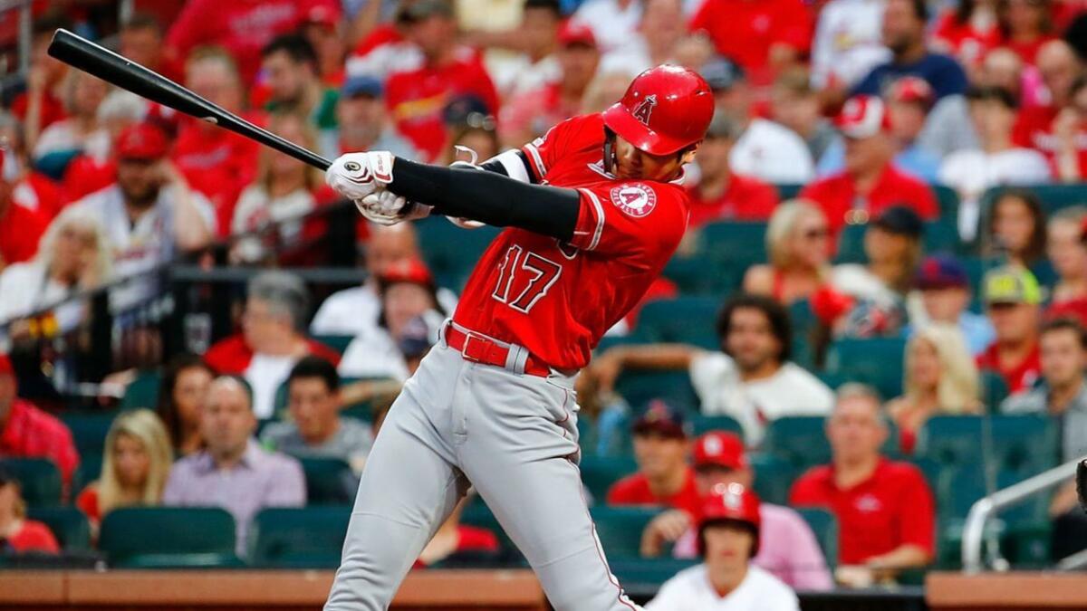Angels designated hitter Shohei Ohtani swings at a pitch during a victory Sunday over the St. Louis Cardinals. Ohtani says he's be honored to compete in the Major League Baseball home run derby.