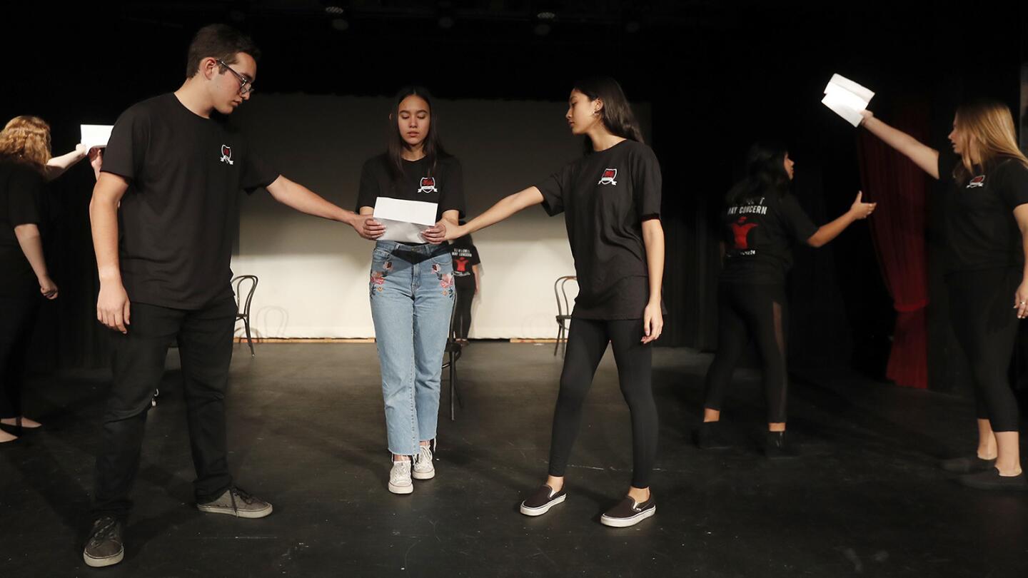 Estancia High School drama students perform a scene during rehearsals for "To Whom It May Concern," an original play written by the students that they will be performing from January 17-19.