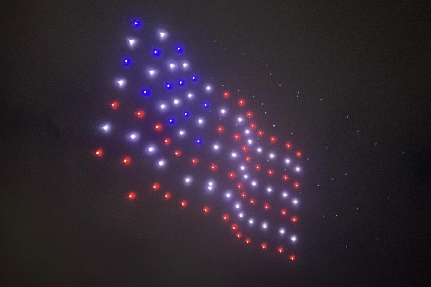 The American flag appeared to wave as the drones moved.
