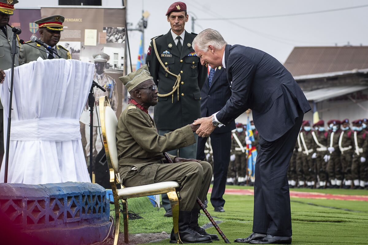King Philippe of Belgium greets 100-year-old corporal Albert Kunyuku