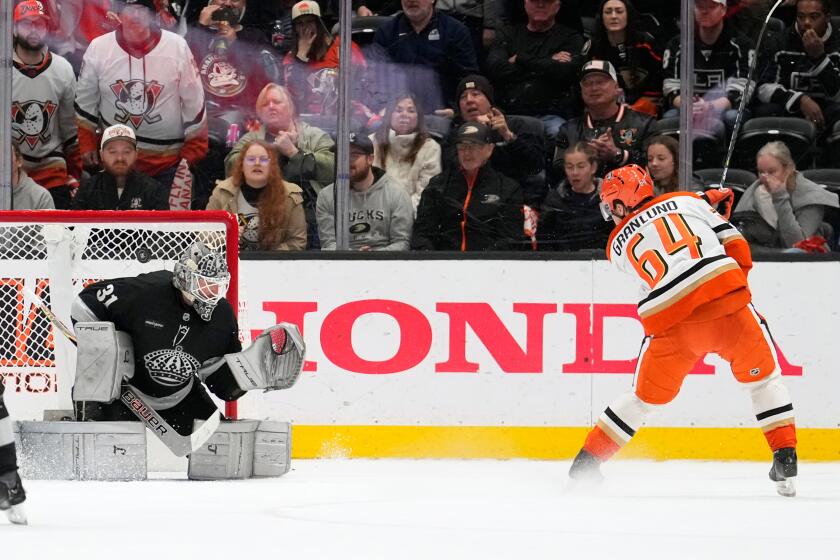 Ducks forward Mikael Granlund, right, scores past Kings goaltender Anton Forsberg.