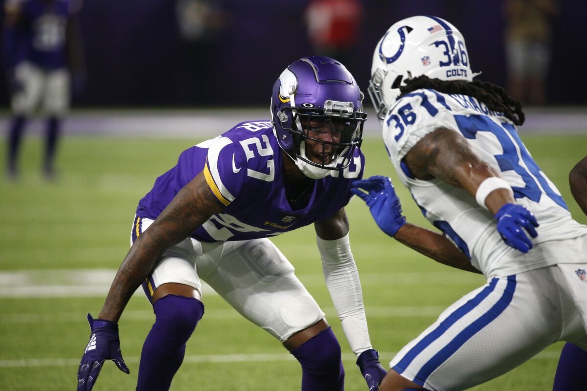 FILE - Minnesota Vikings cornerback Cameron Dantzler (27) defends against Indianapolis Colts' Andre Chachere (36) during the first half of an NFL football game Aug. 21, 2021, in Minneapolis. Dantzler has had at least as many downs as ups over two years at cornerback for the Vikings, and his starting spot has been threatened by a second-round draft pick in Andrew Booth Jr. (AP Photo/Bruce Kluckhohn, File)