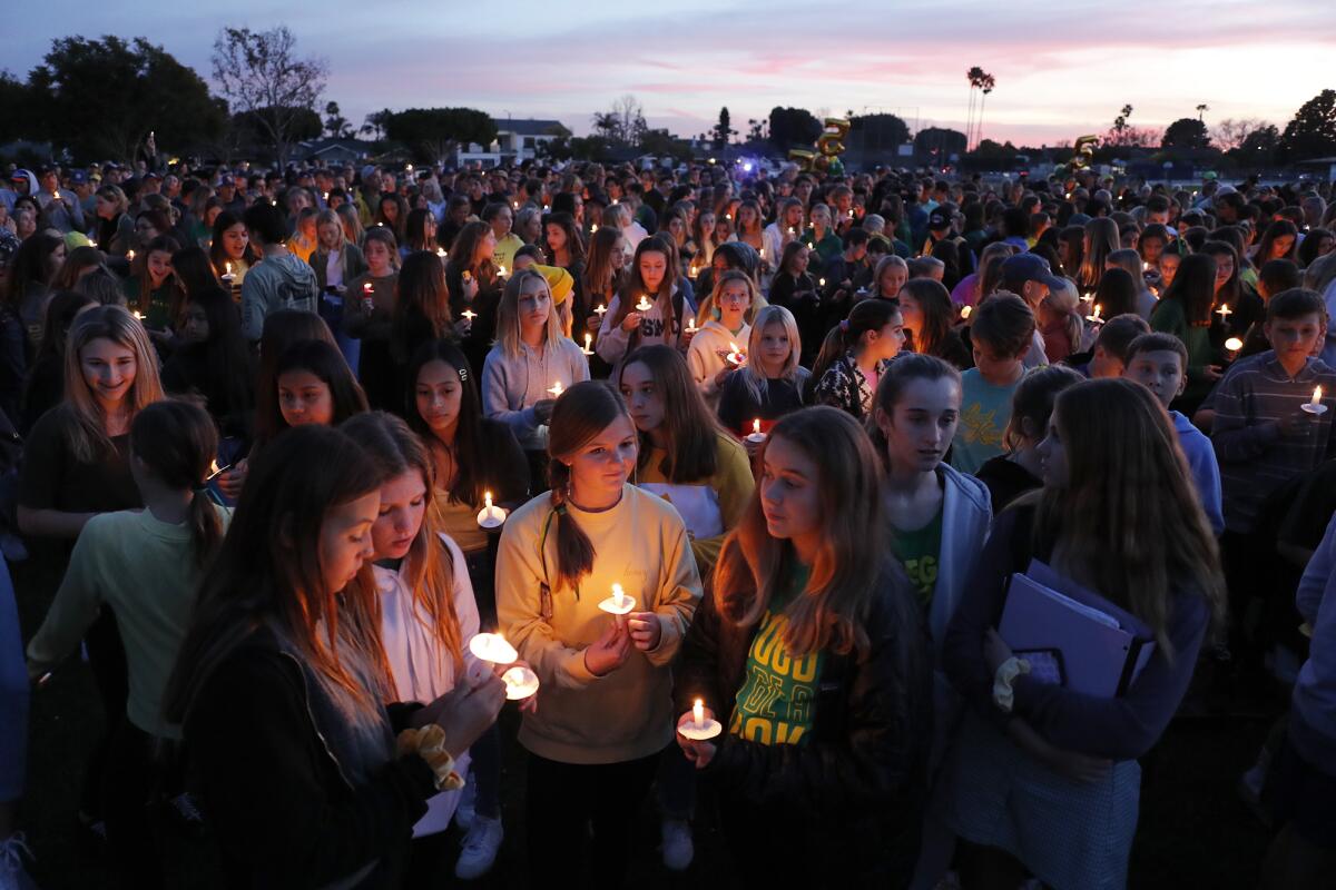Hundreds gather for a candlelight vigil to remember Alyssa Altobelli on Thursday evening at Mariners Park in Newport Beach. Alyssa, her father, John, and mother, Keri, were among the nine people who died in Sunday's helicopter crash in Calabasas.