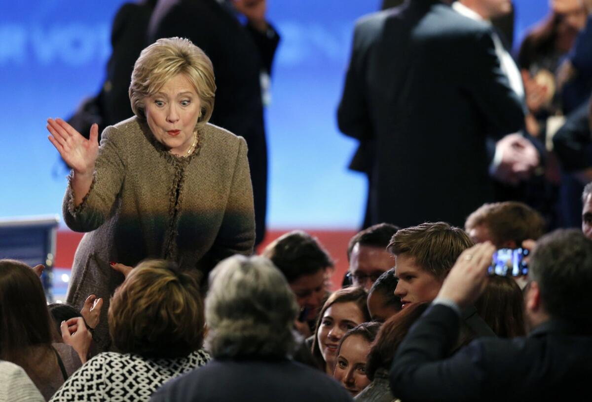 Hillary Clinton greets supporters after a Democratic presidential primary debate in Manchester, N.H. Democrats and Republicans appear to have reached different points in their campaigns.