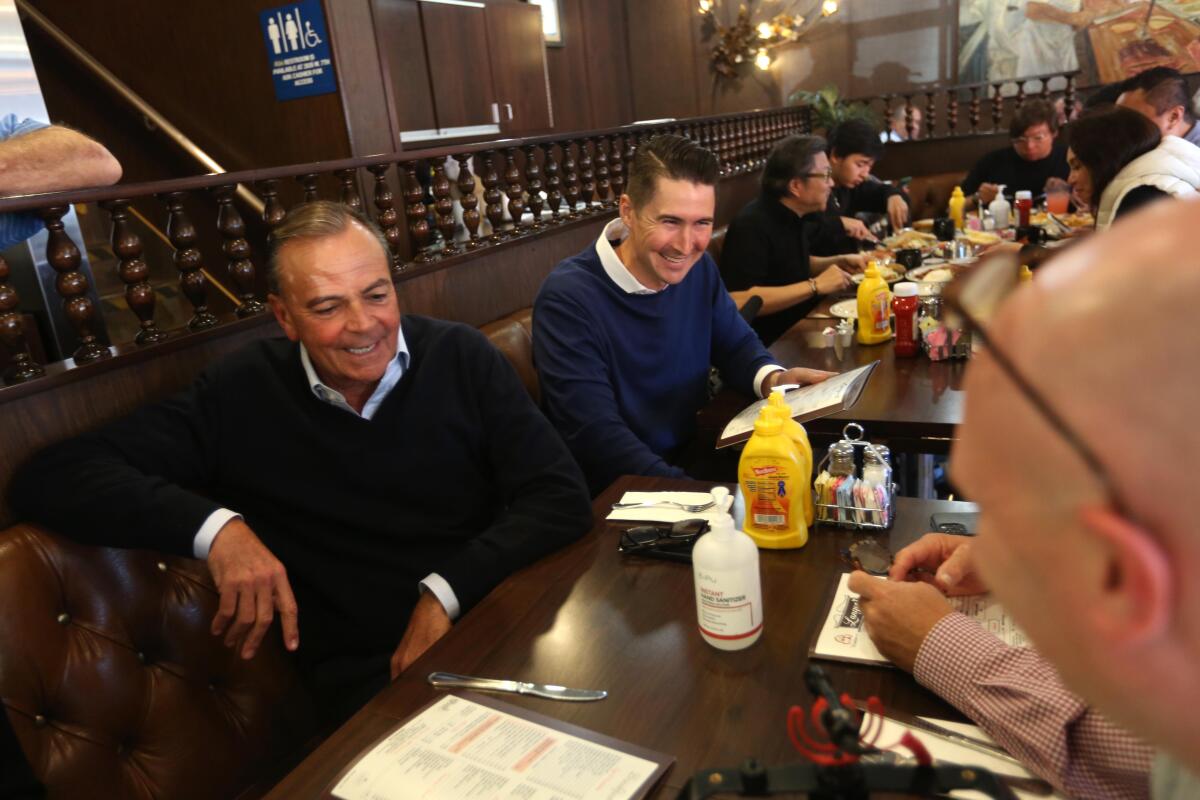 A group of people at a restaurant table