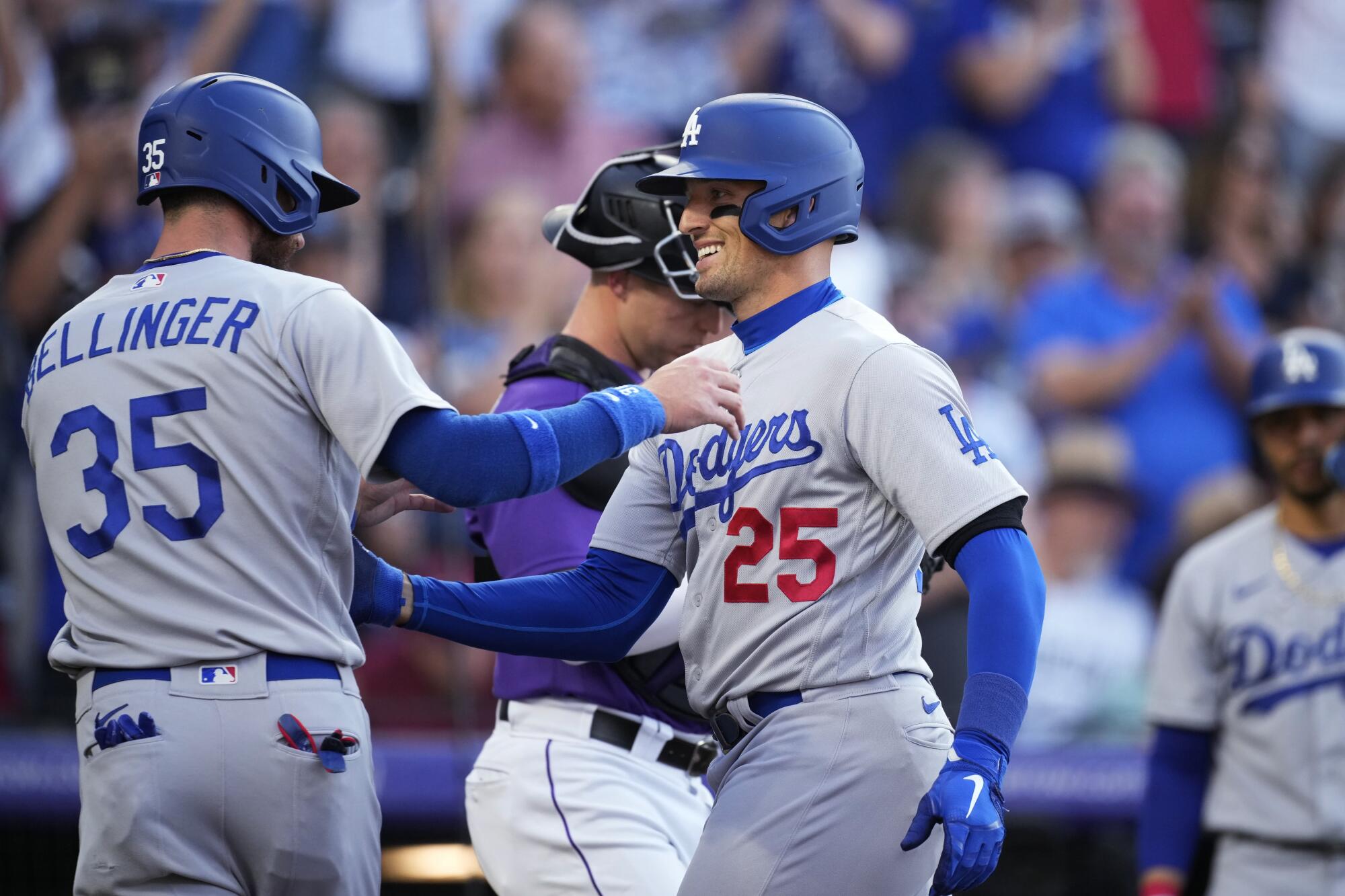 Trayce Thompson, right, is congratulated by Cody Bellinger after hitting a two-run home run against the Colorado Rockies.