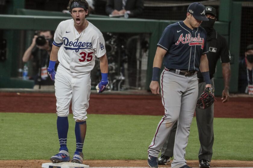 Arlington, Texas, Tuesday, October 13, 2020. Los Angeles Dodgers center fielder Cody Bellinger (35) yells out "let's go!" to teammates after hitting an rbi triple in the bottom of the ninth to bring the Dodgers within a run of the Braves in game two of the NLCS at Globe Life Field. (Robert Gauthier/ Los Angeles Times)