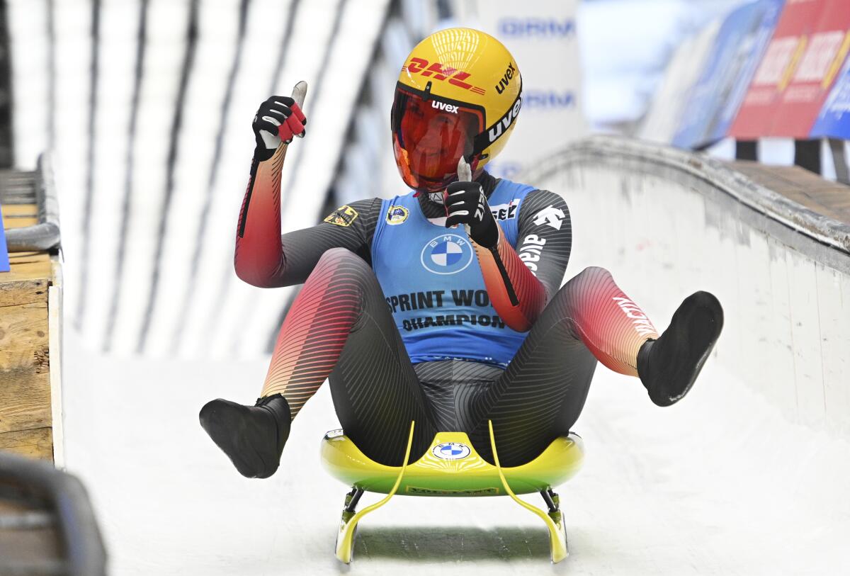 Julia Taubitz of Germany reacts after the women's competition at the Luge Sprint World Cup 2021/2022 in Sochi, Russia, Sunday, Dec. 5, 2021. (AP Photo/Ekaterina Lyzlova)