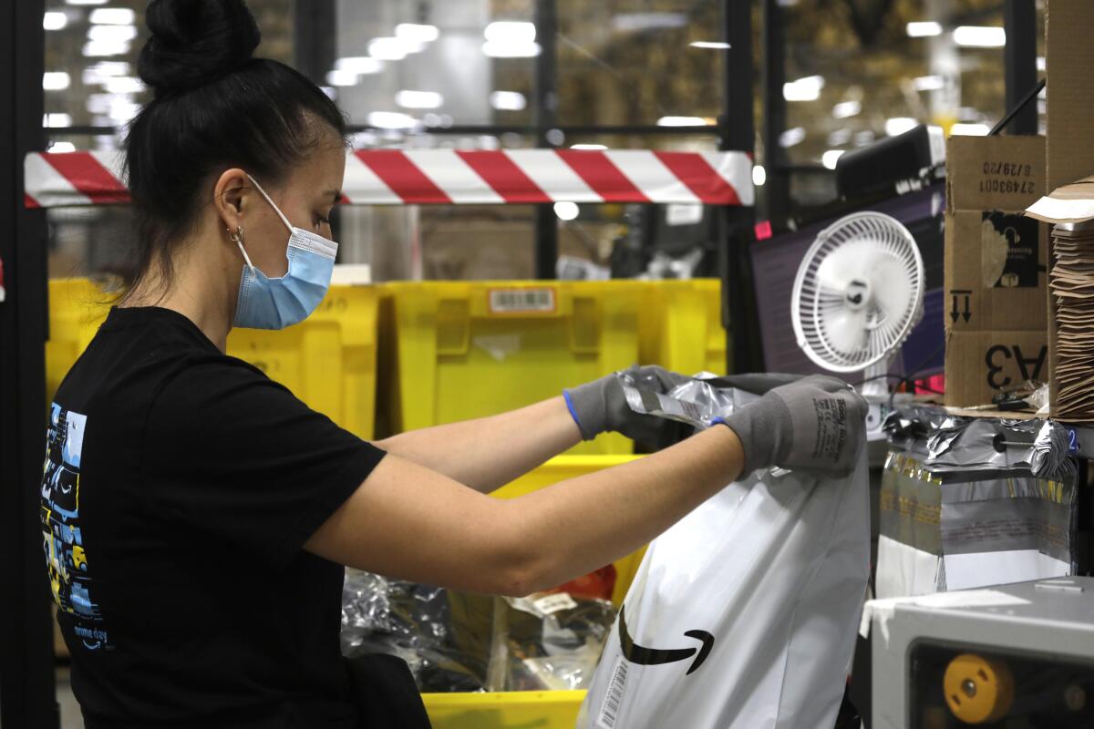 A small fan keeps a worker cool.